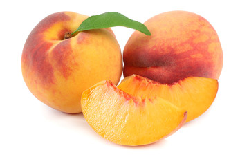 peach fruit with green leaf and slices isolated on white background