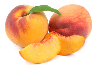 peach fruit with green leaf and slices isolated on white background