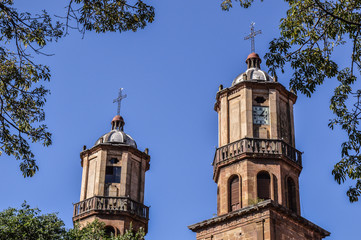 two towers with blue sky background