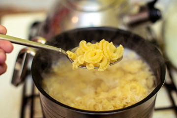Pasta is cooked in a saucepan