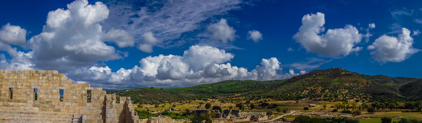 Fototapeta na wymiar Panoramic landscape from Bouleuterion in Patara (Pttra) Ancient City. The assembly hall of Lycia public. The Lycian League's capital was at Patara.