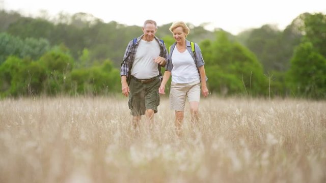 Happy senior Caucasian European couple wearing casual clothing on vacation enjoying their leisure outdoors 