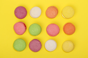 Bright background with rows of macaroons