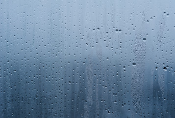 texture of wet drops on the glass. thaw