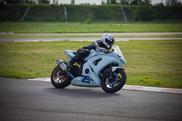 Moto-athlete on the racetrack.