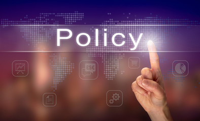 A hand selecting a Policy business concept on a clear screen with a colorful blurred background.