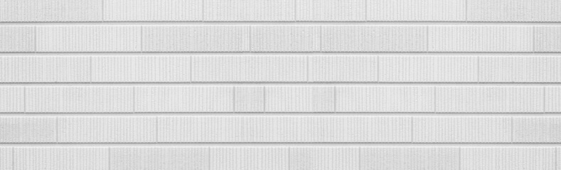 Fototapeta premium Panorama of White modern stone tile wall pattern and background