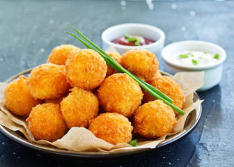cheese balls with tomato sauce.
