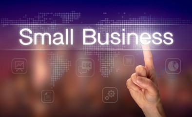 A hand selecting a Small Business business concept on a clear screen with a colorful blurred background.