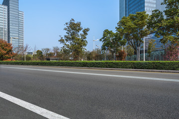 Empty urban road and modern office buildings.
