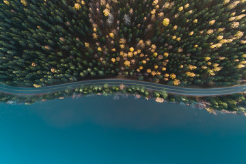 Above view of a road by lake and autumn forest, Finland