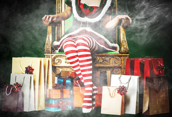Christmas time and slim young woman legs with smoke decoration 