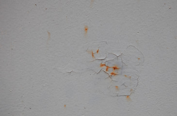 Texture background.Carcked paint on a metal wall with rust