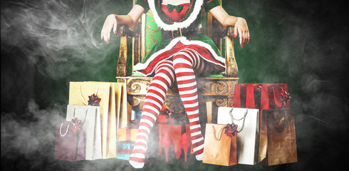Fototapeta na wymiar slim young woman legs and christmas decoration 