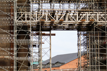 scaffolding mounted on the arch