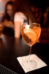 Classic Manhattan alcoholic cocktail served in a glass with a slice of orange peel