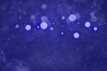 Fototapeta na wymiar blue nice shiny glitter lights defocused bokeh abstract background with falling snow flakes fly, festive mockup texture with blank space for your content