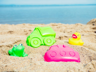 Fototapeta na wymiar kids toys on tropical sand beach