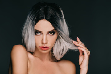 sensual glamor naked girl posing in grey wig, isolated on black