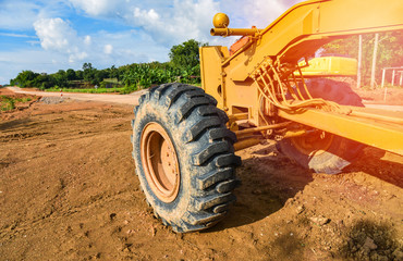 road construction with motor grader road / yellow of modern grader