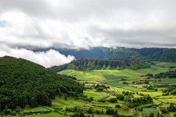 A road past beautiful pastures and two volcanic calderas in Sete Cidades, Sao Miguel.