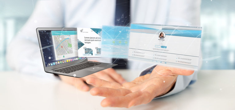 Businessman holding a Website application going out a laptop screen 3d rendering