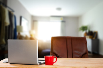 workspace with computer, laptop, office supplies, and coffee cup, smartphone, and tablet at office. desk work concept. in morning light