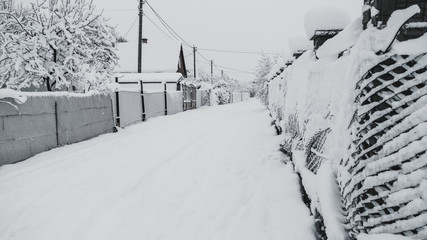 Magic fairy tale Only crumbly snow fell. Street and fences in the snow. All white