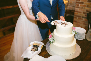 cuting of white wedding cake