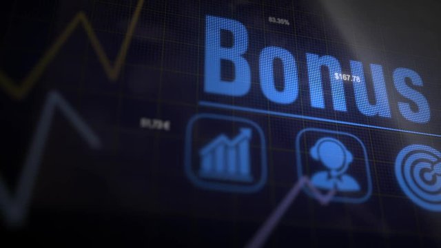 Bonus business concept on a flashing computer monitor with moving graphs and data.