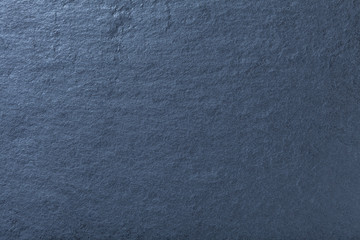 Dark blue background of natural slate. Texture of stone