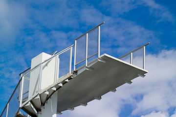 Outdoor swimming pool diving board