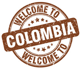 welcome to Colombia brown round vintage stamp