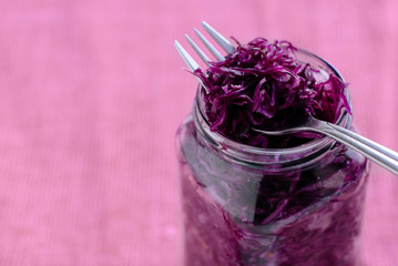 Fork on jar with purple sauerkraut