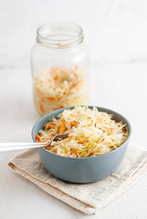 Jar and bowl with sauerkraut