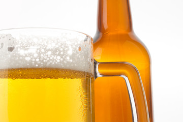 Beer glass and bottle on the white background