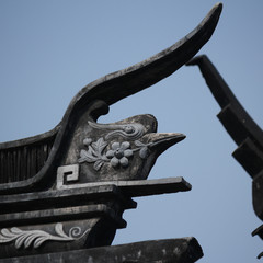 Roof top stone carving decoration showing a bird in the old town in Suzhou city, China, Asia
