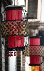 Chinese style lanterns as street decoration hanging on the exterior wall of a restaurant and shop in Suzhou old town, Suzhou city, China, Asia