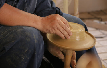  Sculptor artist making craft from fresh wet clay