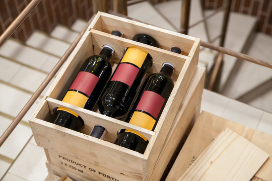 Bottle Of Red Wine In A Wooden Box