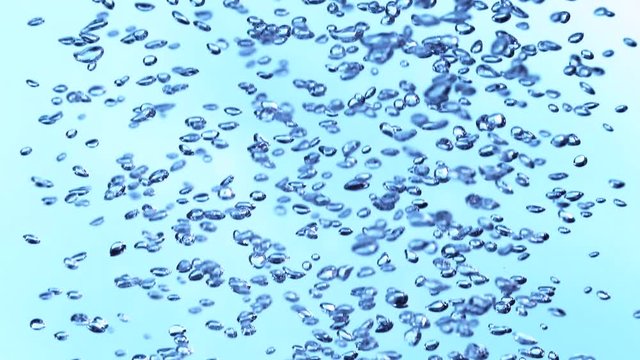 Super slow motion of bubbling water on white background. Filmed on high speed cinema camera, 1000 fps.