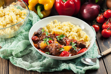 Hungarian beef goulash serwed with galuska noodles