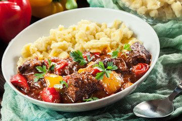 Hungarian beef goulash serwed with galuska noodles