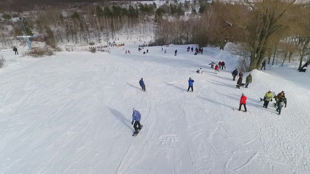 aerial of snowboarders sliding down the snowy slope. extreme sports, winter activities, healthy lifestyle