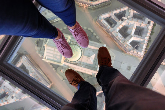 Couple's legs on the glass floor above the Paris mockup