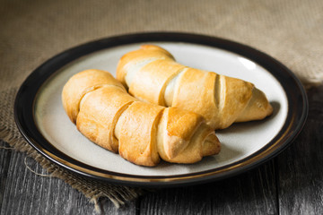 Buns on a wooden table. Rustic style