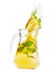 Jug with spilling homemade lemonade