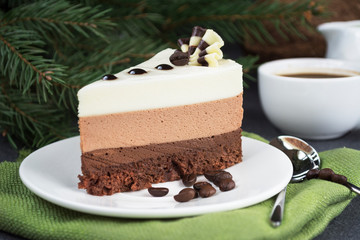 Three chocolate mousse cake slice on a small plate.  Amazing dessert
