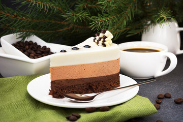 Three chocolate mousse cake slice on a small plate.  Amazing dessert