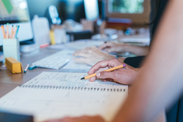 Papers and notes on busy desktop